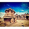 Vintage retro effect filtered hipster style travel image of tourist attraction landmark - Stone chariot in Vittala temple. Hampi, Karnataka, India