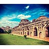 Vintage retro effect filtered hipster style travel image of Ancient ruins of Elephant Stables, Royal Centre. Hampi, Karnataka, India. Stitched panorama