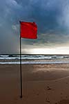 Severe storm warning flags on beach. Baga, Goa, India