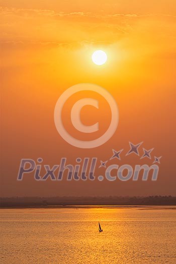 Yacht boats silhouettes in lake on sunset Yacht boats silhouettes in lake on sunset