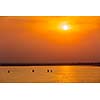 Yacht boats silhouettes in lake on sunset