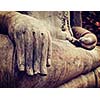 Vintage retro effect filtered hipster style travel image of Buddha statue hand close up detail. Sukhothai, Thailand