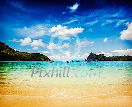 Vintage retro effect filtered hipster style travel image of long tail boats in bay. Phi Phi Island, Krabi, Thailand Vintage retro effect filtered hipster style travel image of long tail boats in bay. Phi Phi Island, Krabi, Thailand