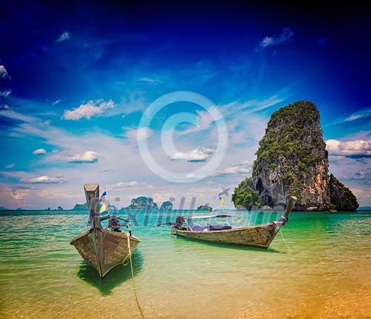 Vintage retro effect filtered hipster style travel image of long tail boats on tropical Pranang beach, Krabi, Thailand