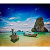 Vintage retro effect filtered hipster style travel image of long tail boats on tropical Pranang beach, Krabi, Thailand