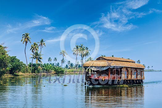 Travel tourism Kerala background - houseboat on Kerala backwaters. Kerala, India Travel tourism Kerala background - houseboat on Kerala backwaters. Kerala, India