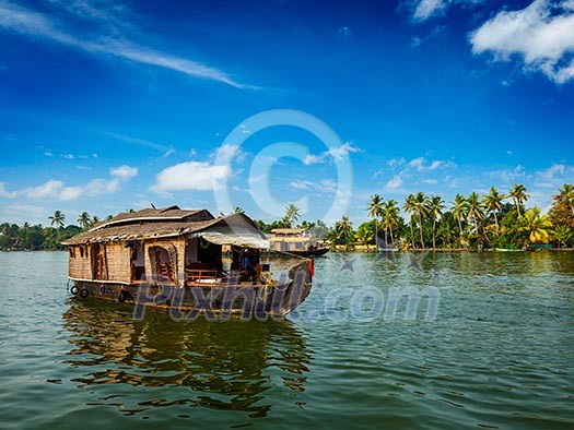 Travel tourism Kerala background - houseboat on Kerala backwaters. Kerala, India Travel tourism Kerala background - houseboat on Kerala backwaters. Kerala, India