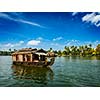 Travel tourism Kerala background - houseboat on Kerala backwaters. Kerala, India