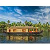 Travel tourism Kerala background - houseboat on Kerala backwaters. Kerala, India