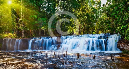Tropical waterfall Phnom Kulen on sunrise, Cambodia Tropical waterfall Phnom Kulen on sunrise, Cambodia