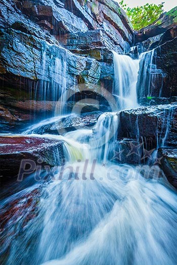 Tropical waterfall. Popokvil Waterfall, Bokor National Park, Cambodia Tropical waterfall. Popokvil Waterfall, Bokor National Park, Cambodia