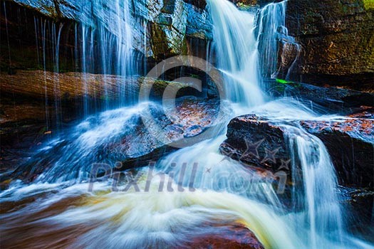 Tropical waterfall. Popokvil Waterfall, Bokor National Park, Cambodia Tropical waterfall. Popokvil Waterfall, Bokor National Park, Cambodia