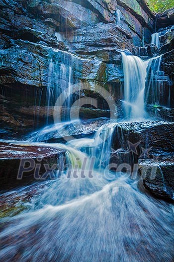 Tropical waterfall. Popokvil Waterfall, Bokor National Park, Cambodia Tropical waterfall. Popokvil Waterfall, Bokor National Park, Cambodia