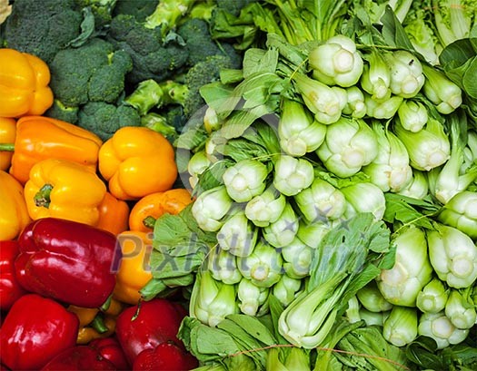 Vegetables in Asian market close up - Capsicum bell peppers, broccoli  cabbage, Green chinese cabbage
