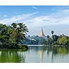 Travel Myanmar tourism background - view of  Shwedagon Pagoda over Kandawgyi Lake in Yangon, Burma Myanmar