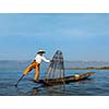 Myanmar travel attraction landmark - Traditional Burmese fisherman at Inle lake, Myanmar famous for their distinctive one legged rowing style