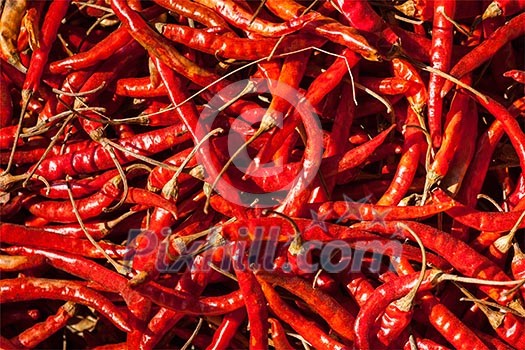 Red spicy chili peppers at asian market close up texture background Red spicy chili peppers at asian market close up texture background