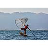 Myanmar travel attraction landmark - Traditional Burmese fisherman at Inle lake, Myanmar famous for their distinctive one legged rowing style