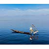 Myanmar travel attraction landmark - Traditional Burmese fisherman at Inle lake, Myanmar famous for their distinctive one legged rowing style