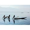 Myanmar travel attraction landmark - Traditional Burmese fisherman at Inle lake, Myanmar famous for their distinctive one legged rowing style