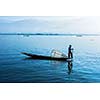 Myanmar travel attraction landmark - Traditional Burmese fisherman at Inle lake, Myanmar famous for their distinctive one legged rowing style