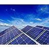 Solar power generation technology, green alternative energy and environment protection ecology business concept background - solar battery panels under blue sky