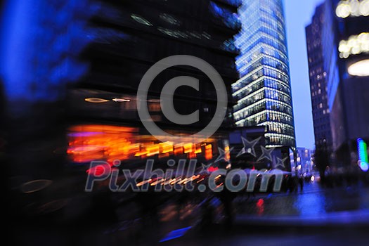 busy traffic scene of street in night  with car traffic and vivid colored city scene