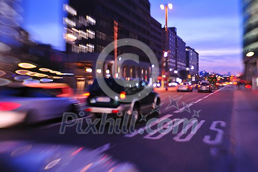 busy traffic scene of street in night with car traffic and vivid colored city scene busy traffic scene of street in night with car traffic and vivid colored city scene