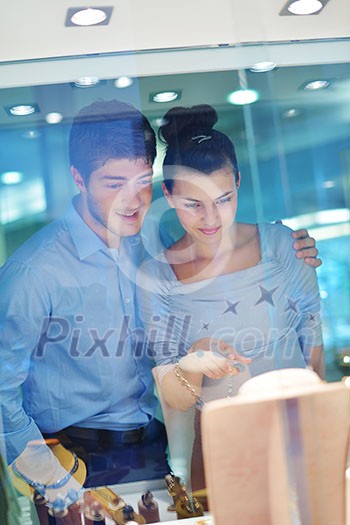 happy young romantic couple in love buy jewelry ring in luxury store happy young romantic couple in love buy jewelry ring in luxury store