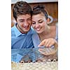 happy young romantic couple in love buy jewelry ring in luxury store