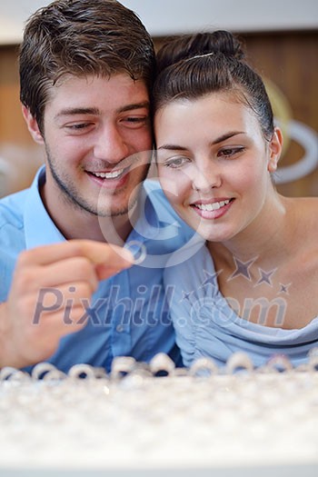 happy young romantic couple in love buy jewelry ring in luxury store happy young romantic couple in love buy jewelry ring in luxury store