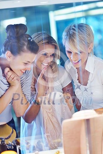 happy girls group have fun while shopping in jewelry store happy girls group have fun while shopping in jewelry store