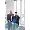 Pretty female university graduate with her happy and proud father, moments after getting the diploma