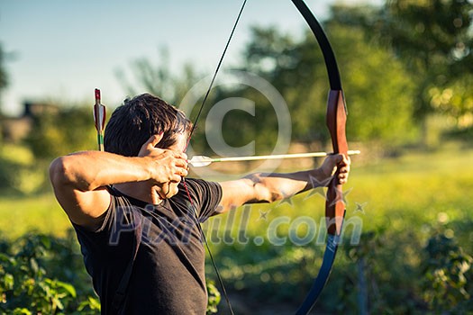 Young archer training with the  bow