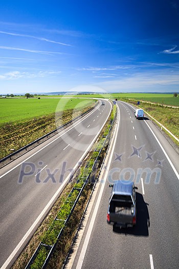 highway traffic on a lovely, sunny summer day highway traffic on a lovely, sunny summer day