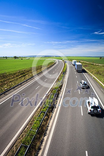 highway traffic on a lovely, sunny summer day highway traffic on a lovely, sunny summer day