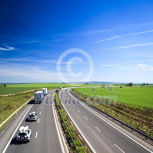 highway traffic on a lovely, sunny summer day highway traffic on a lovely, sunny summer day