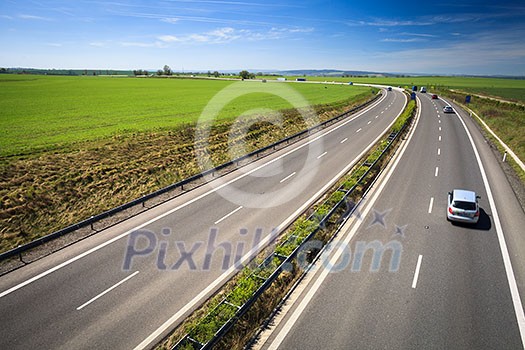 highway traffic on a lovely, sunny summer day highway traffic on a lovely, sunny summer day