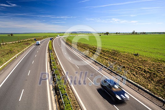 highway traffic on a lovely, sunny summer day highway traffic on a lovely, sunny summer day