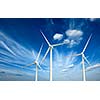 Green renewable energy concept - wind generator turbines in sky