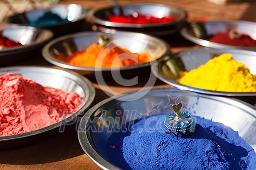 Colored colorful powder kumkum on Indian bazaar for holi festival celebration