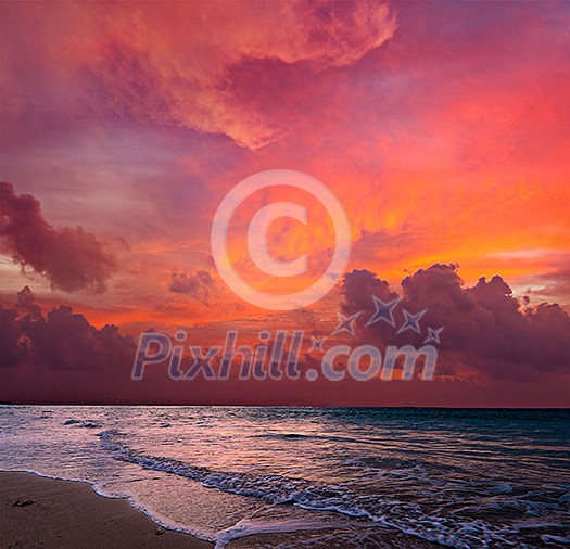 Calm peaceful ocean and beach on tropical sunrise. Bali, Indonesia
