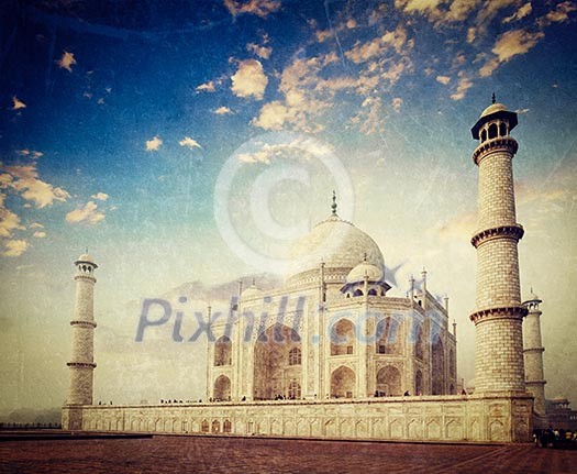 Vintage retro hipster style travel image of 
Taj Mahal on sunrise. Indian Symbol - India travel background with grunge texture overlaid. Agra, India