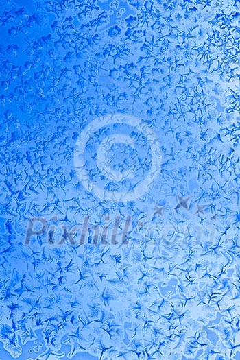 Frost patterns on window glass in winter Frost patterns on window glass in winter