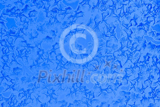 Frost patterns on window glass in winter Frost patterns on window glass in winter