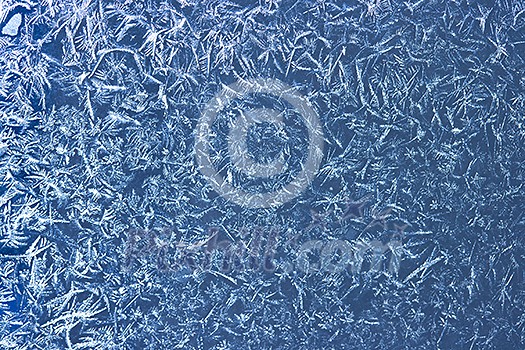Frost patterns on window glass in winter Frost patterns on window glass in winter