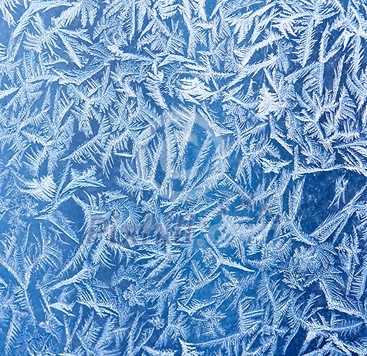 Frost patterns on window glass in winter Frost patterns on window glass in winter
