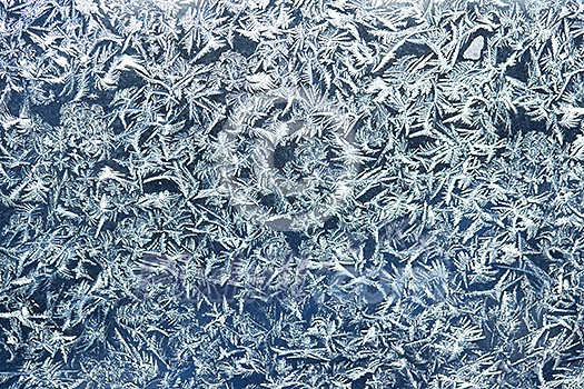 Frost patterns on window glass in winter Frost patterns on window glass in winter