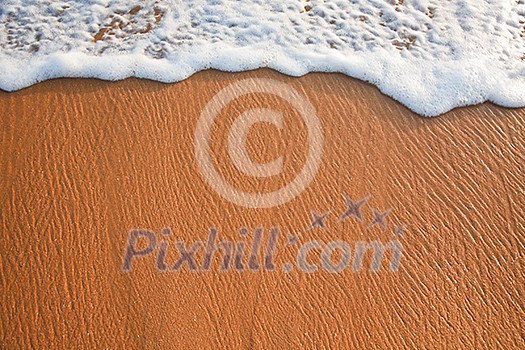 Wave surging on sand on beach. Lots of copyspace Wave surging on sand on beach. Lots of copyspace