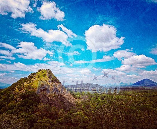 Vintage retro hipster style travel image of sky above small mountains, covered with trees with grunge texture overlaid. Sri Lanka Vintage retro hipster style travel image of sky above small mountains, covered with trees with grunge texture overlaid. Sri Lanka